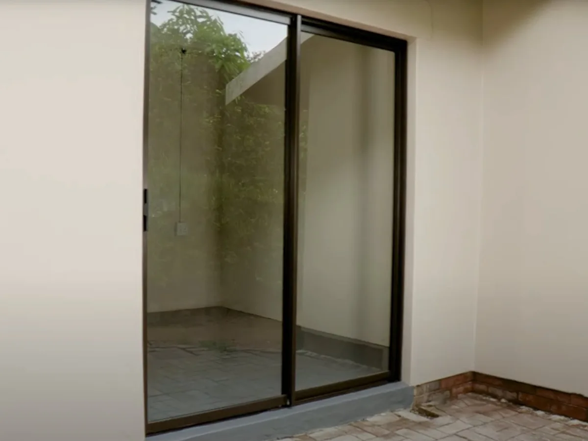 Sliding glass door and frame