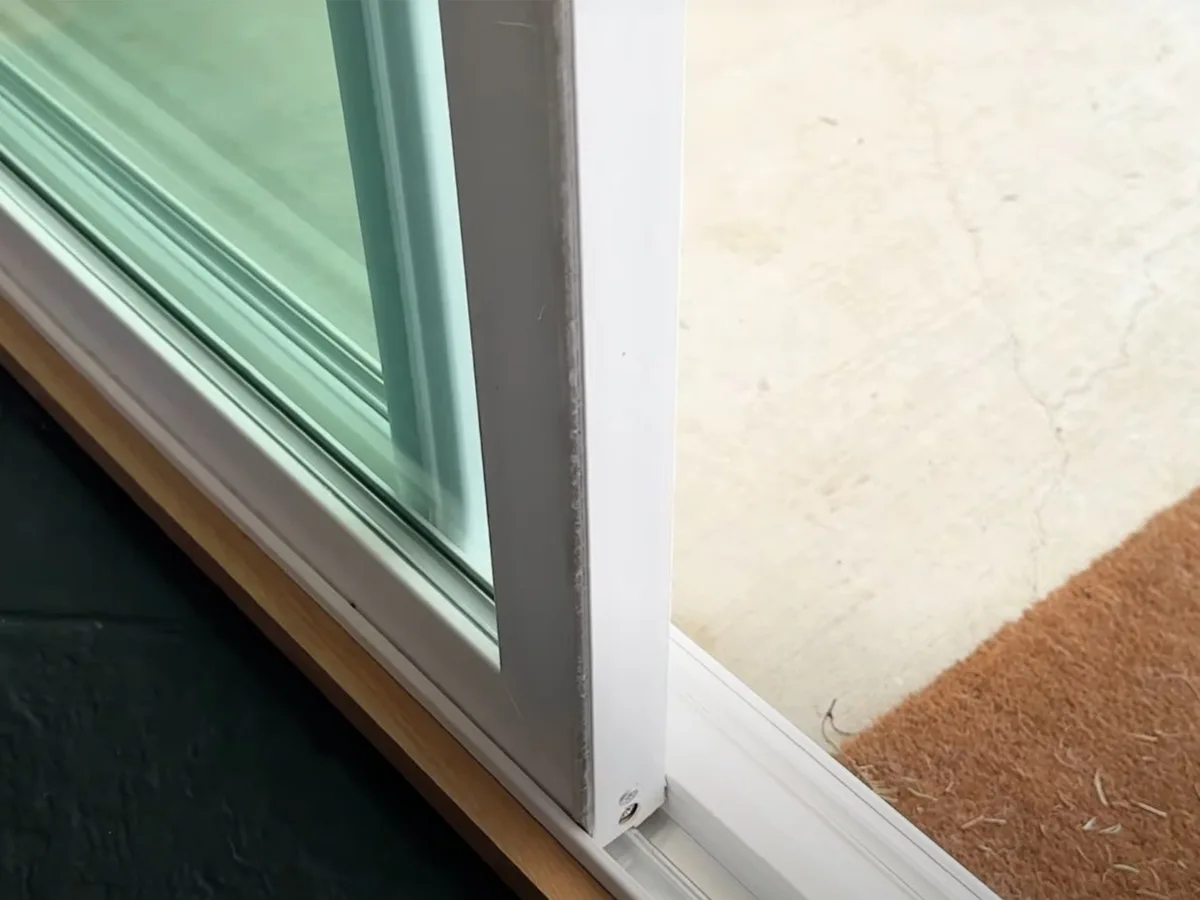 Lower edge and track of a sliding glass door